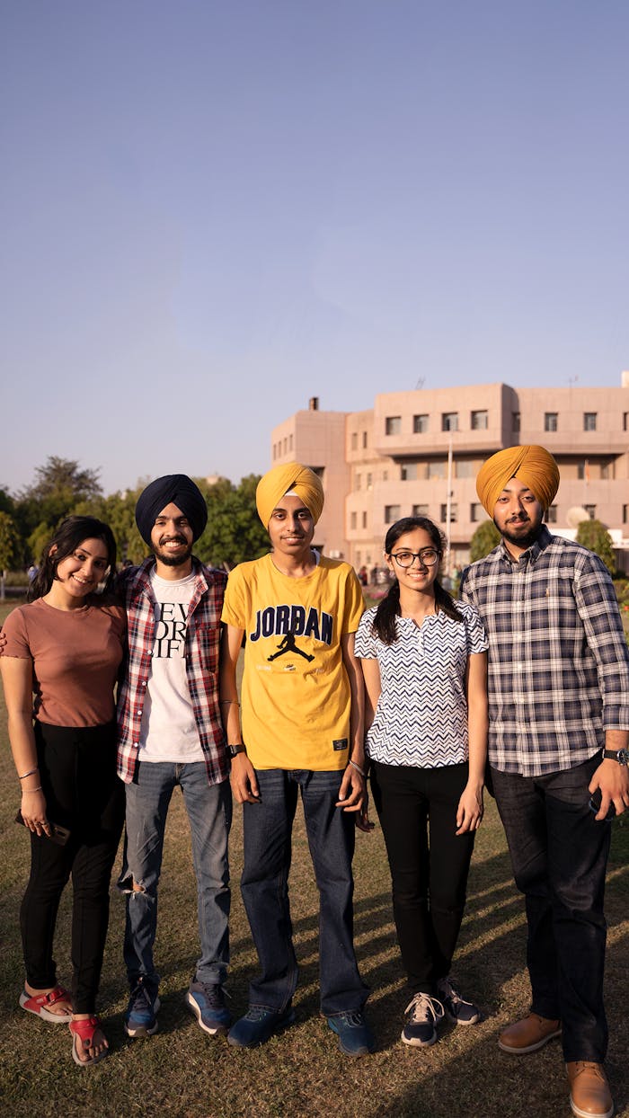 A cheerful group of young adults enjoying a sunny day together outdoors.